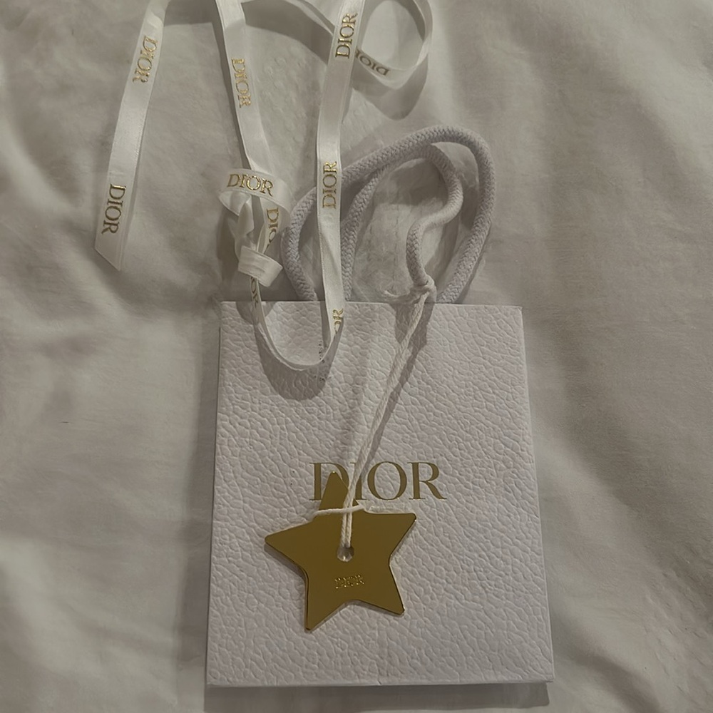 Dior bag, charm, and ribbon